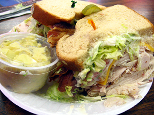 Perry's Deli Turkey Club with bacon as hard as iron